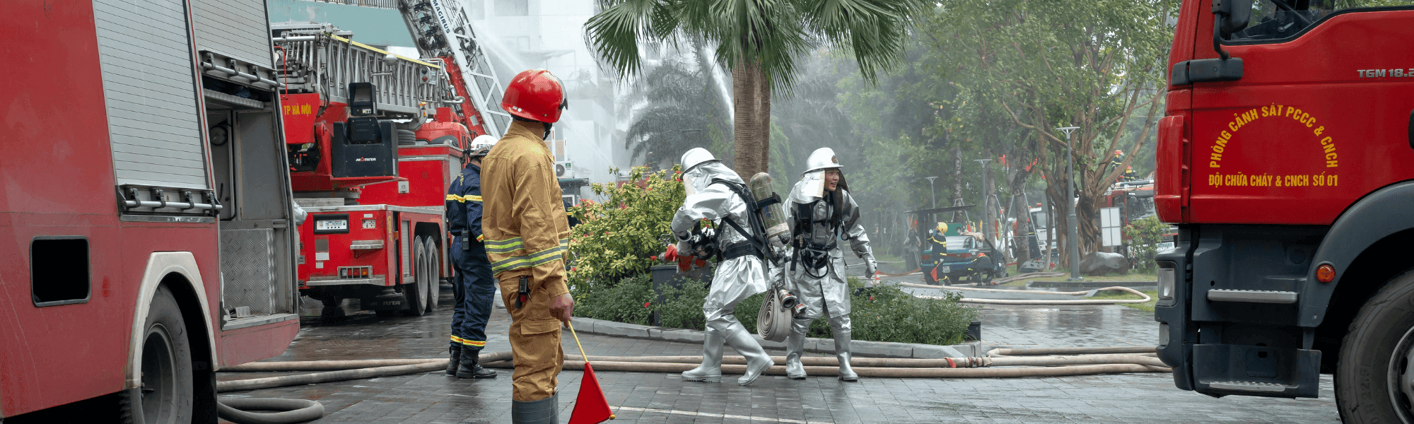 SCDF operators working an emergency-response videowall